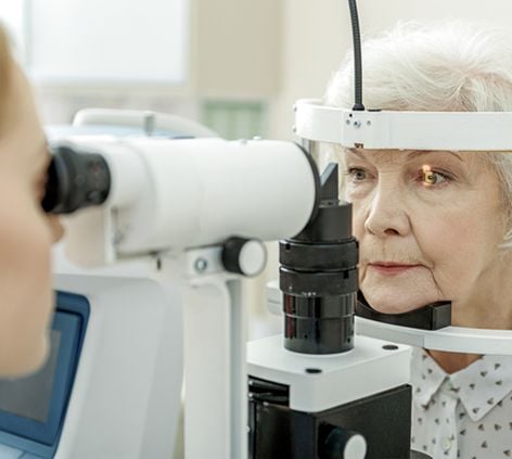 Opthalmologist Examining the Eye of an Old Woman
